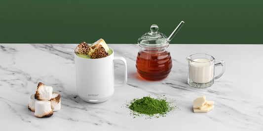 Matcha Hot Chocolate in a white Ember Mug2 and surrounded by toasted marshmallows, honey, and cream.